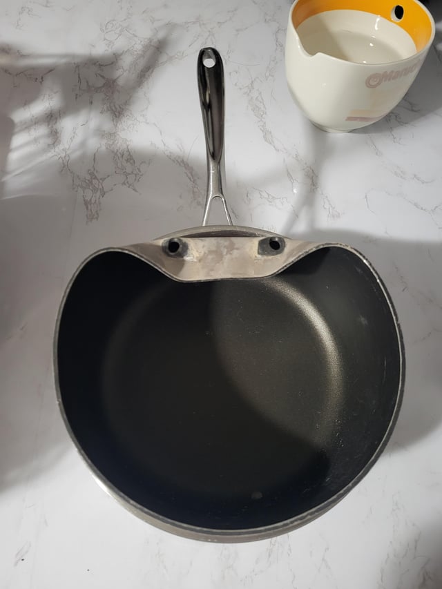 Sauce pans got stuck together and tried to forcibly remove them, now I feel like it's just mocking me.